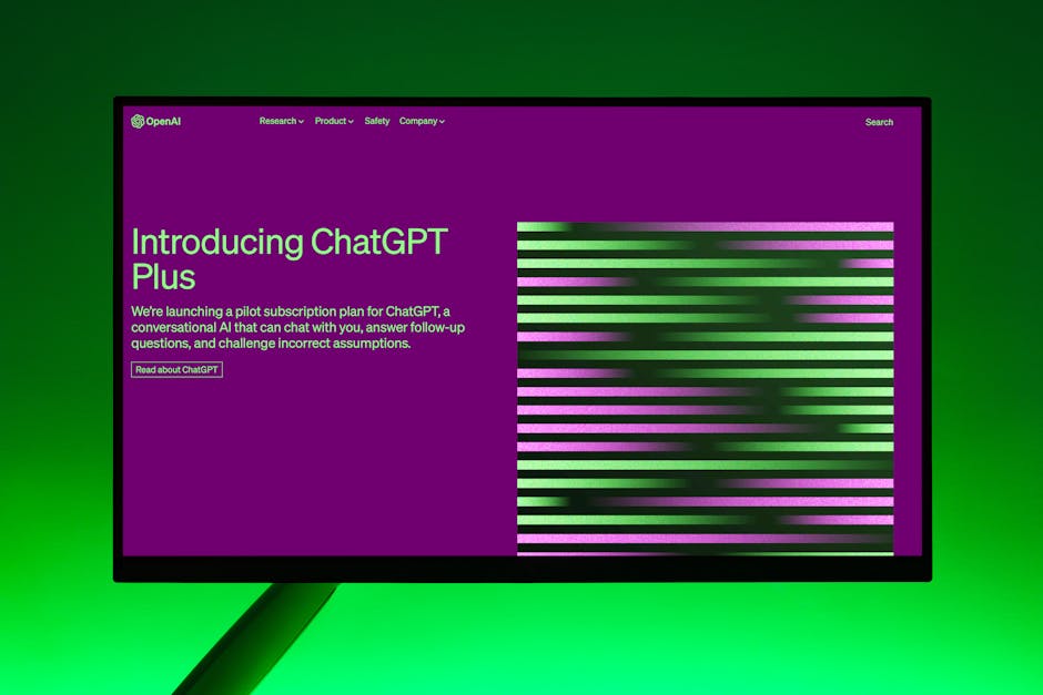 Close-up of a monitor displaying ChatGPT Plus introduction on a green background